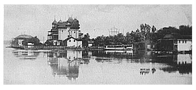 (Image: Long Shot Across Water of the Hotel from the Side)