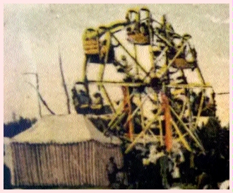 (Image: Ferris Wheel with Riders and Onlookers)